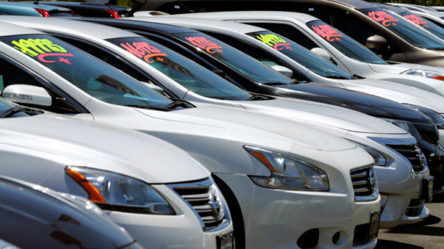 Automobiles are shown for sale at a car dealership in Carlsbad, California